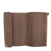 Buy online an authentic second hand Delvaux Taupe leather Loto Wallet in good condition at Labellov in Antwerp.