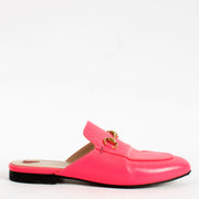 Bold, playful, and undeniably chic — these Gucci Fluo Pink Princetown Mules are a spirited twist on a house classic. Crafted in vibrant fluorescent pink leather, this cult-favourite silhouette reimagines the traditional loafer with a sleek, backless profi