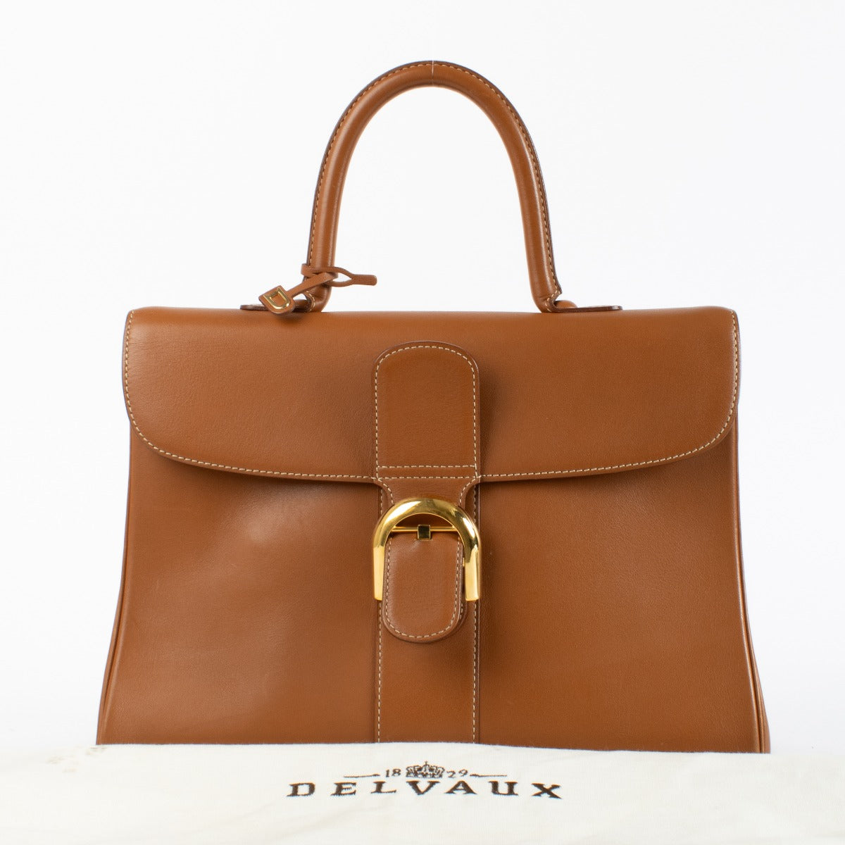 Delvaux Brillant Top Handle Bag in Gold Box Calf leather with gold-tone hardware available at Labellov.com