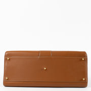 Delvaux Brillant Top Handle Bag in Gold Box Calf leather with gold-tone hardware available at Labellov.com