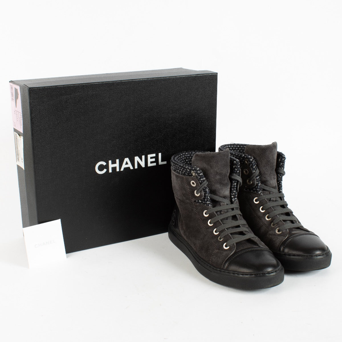Authentic Second Hand Chanel Black High-Top Sneakers Size 39 on Labellov.com