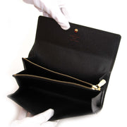 Authentic second hand vintage Louis Vuitton Epi Sarah Wallet Black buy online webshop LabelLOV