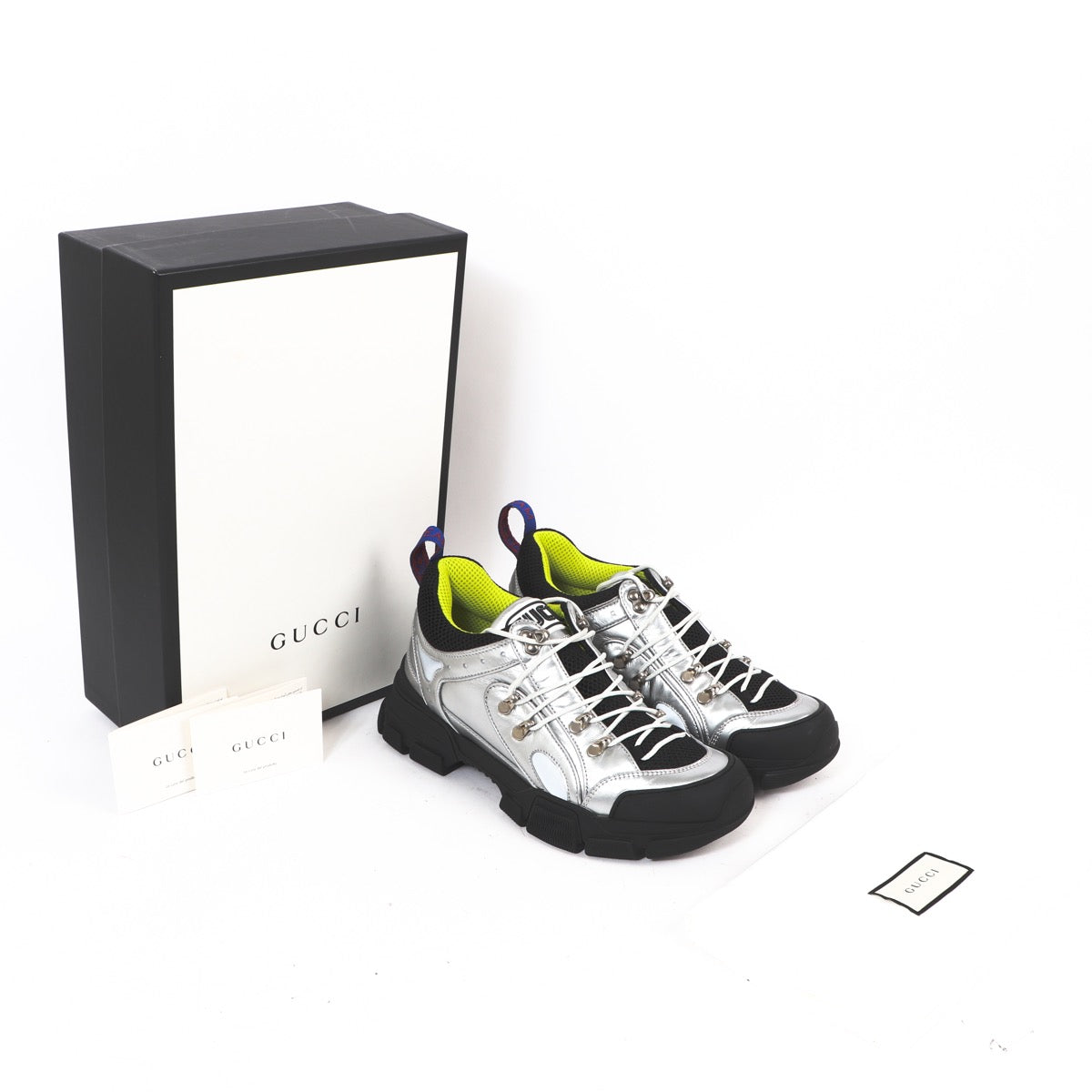 Buy an authentic second hand Gucci Silver Liquid Silk Calf Docro Sneakers - Size 41 in very good condition at Labellov Antwerp.