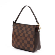 Buy an authentic second-hand Damier Ebene Canvas Mini Pochette Accessoires Top Handle Bag in very good condition at Labellov in Antwerp.