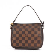 Buy an authentic second-hand Damier Ebene Canvas Mini Pochette Accessoires Top Handle Bag in very good condition at Labellov in Antwerp.