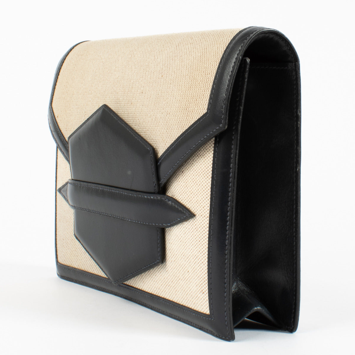 Hermès Faco Clutch embodies the brand's heritage of discreet luxury.