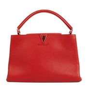 Shop safe online at Labellov in Antwerp, Brussels and Knokke this 100% authentic second hand Louis Vuitton Rubis Taurillon Leather Capucines MM Top Handle