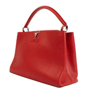 Shop safe online at Labellov in Antwerp, Brussels and Knokke this 100% authentic second hand Louis Vuitton Rubis Taurillon Leather Capucines MM Top Handle