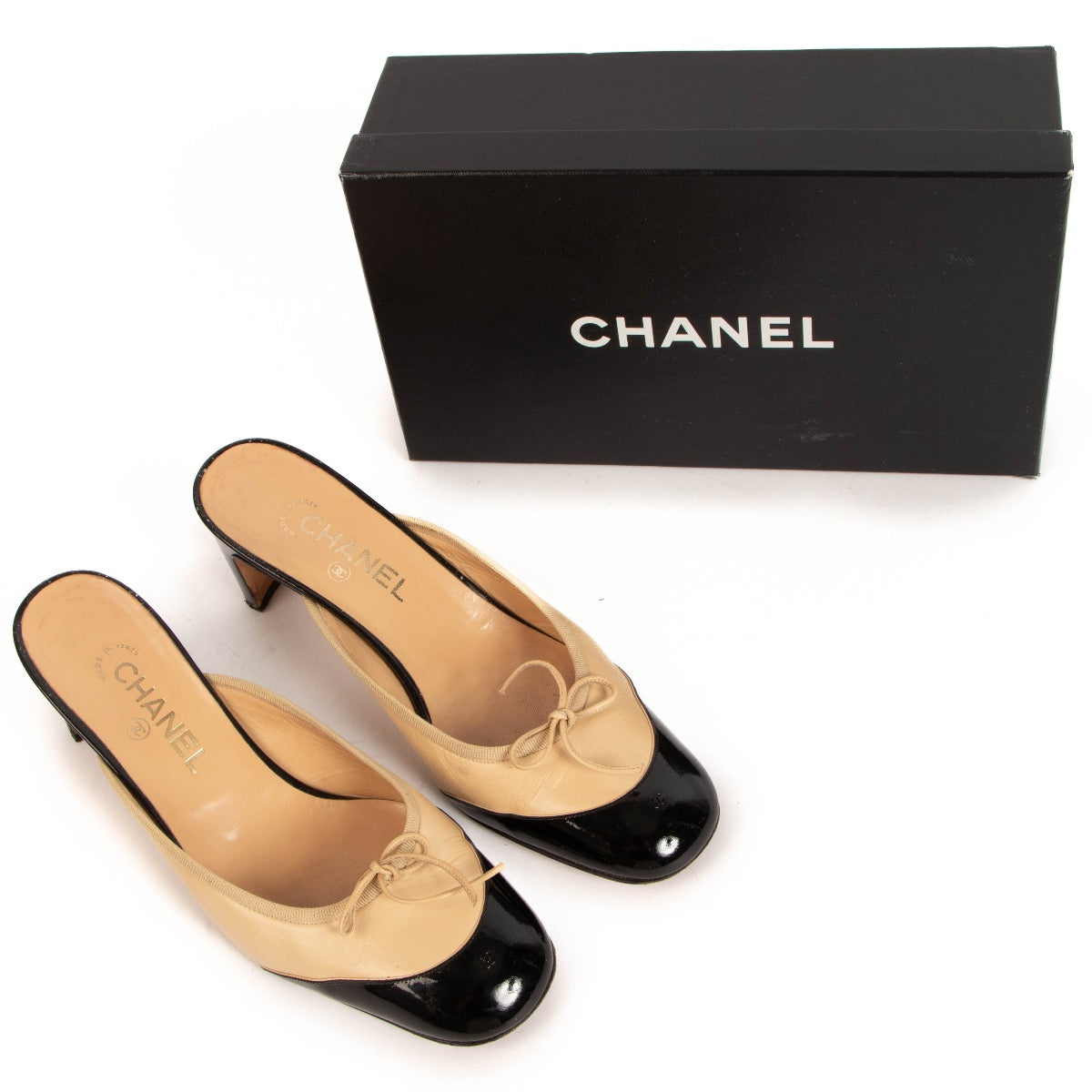shop 100% authentic second hand Chanel Beige And Black Patent Cap Toe Mules - Size 40 1/2 on Labellov.com