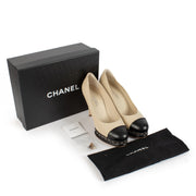 shop 100% authentic second hand Chanel Beige/Black Leather CC Cap Toe Chain Link Platform Pumps - Size 41 on Labellov.com