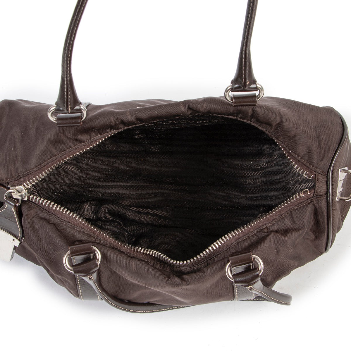 Buy and sell designer items at Labellov Luxury. Get this Prada Brown Nylon Duffle Bag online or in the showroom in Antwerp.