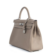 We buy and sell your authentic Hermès Kelly 32 Retourne Veau Etoupe PHW for the best price