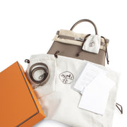 BNIB Hermès Kelly 32 Retourne Veau Etoupe PHW with worldwide shipping available online at Labellov secondhand luxury