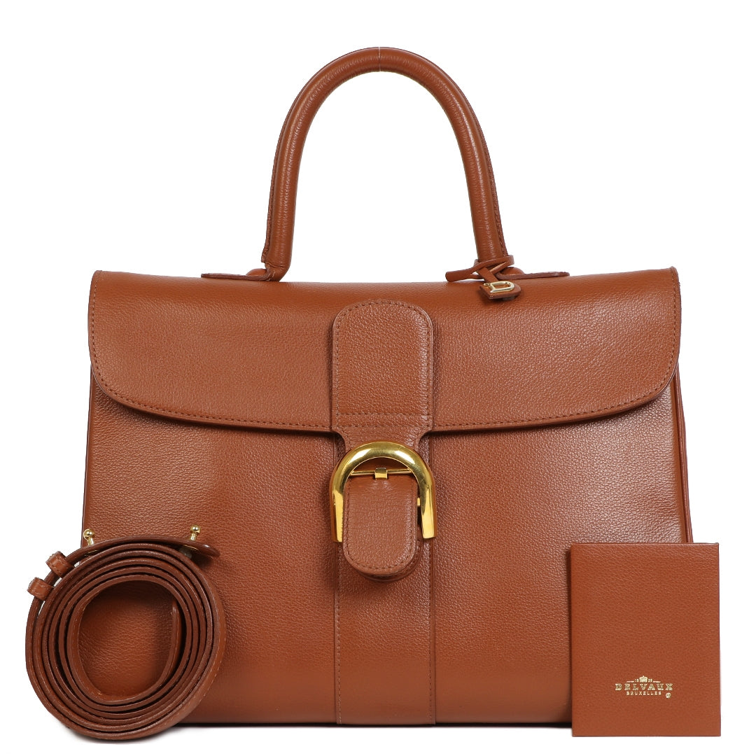 We buy and sell your authentic Delvaux Cognac Brillant GM + Strap for the best price online at Labellov