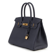 Exclusive and with worldwide shipping Hermès Birkin 30 Bleu Nuit Togo GHW