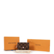 Shop safe online 100% authentic second hand Louis Vuitton Rosalie Damier Rose Ballerine Coin Purse in very good, excellent condition at the right price at labellov in Antwerp.