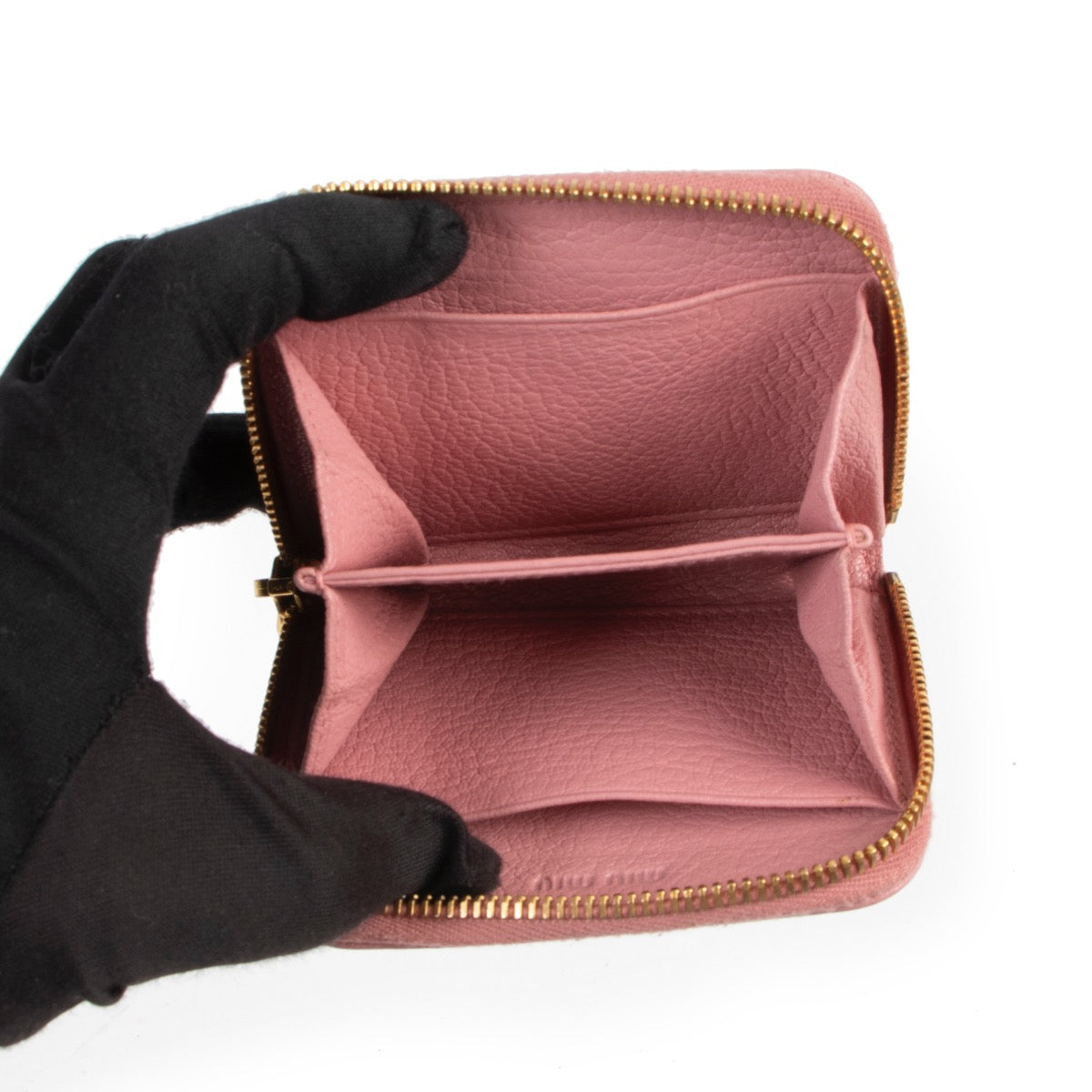 Buy a 100% authentic second hand Miu Miu Pink Zippy Wallet at Labellov