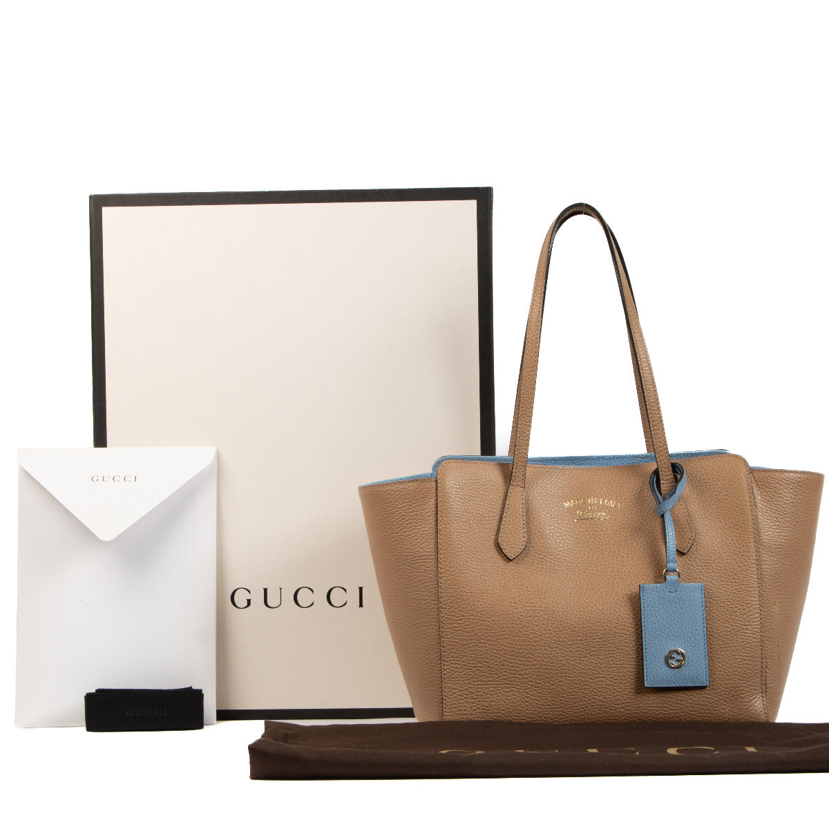 Gucci Beige Swing Shoulder Bag for the best price at Labellov secondhand luxury in Antwerp. We buy and sell your preloved and brand new designer bags for the best price.