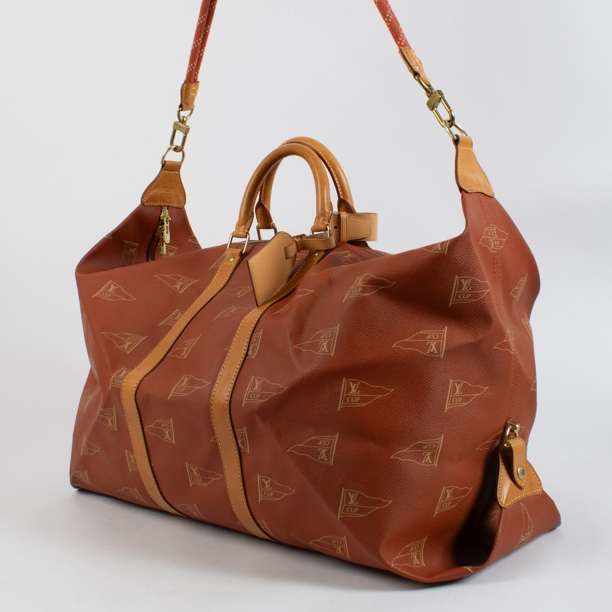 shop 100% authentic second hand Louis Vuitton 1995 LV America's Cup Red Canvas Keepall 60 Bag on Labellov.com