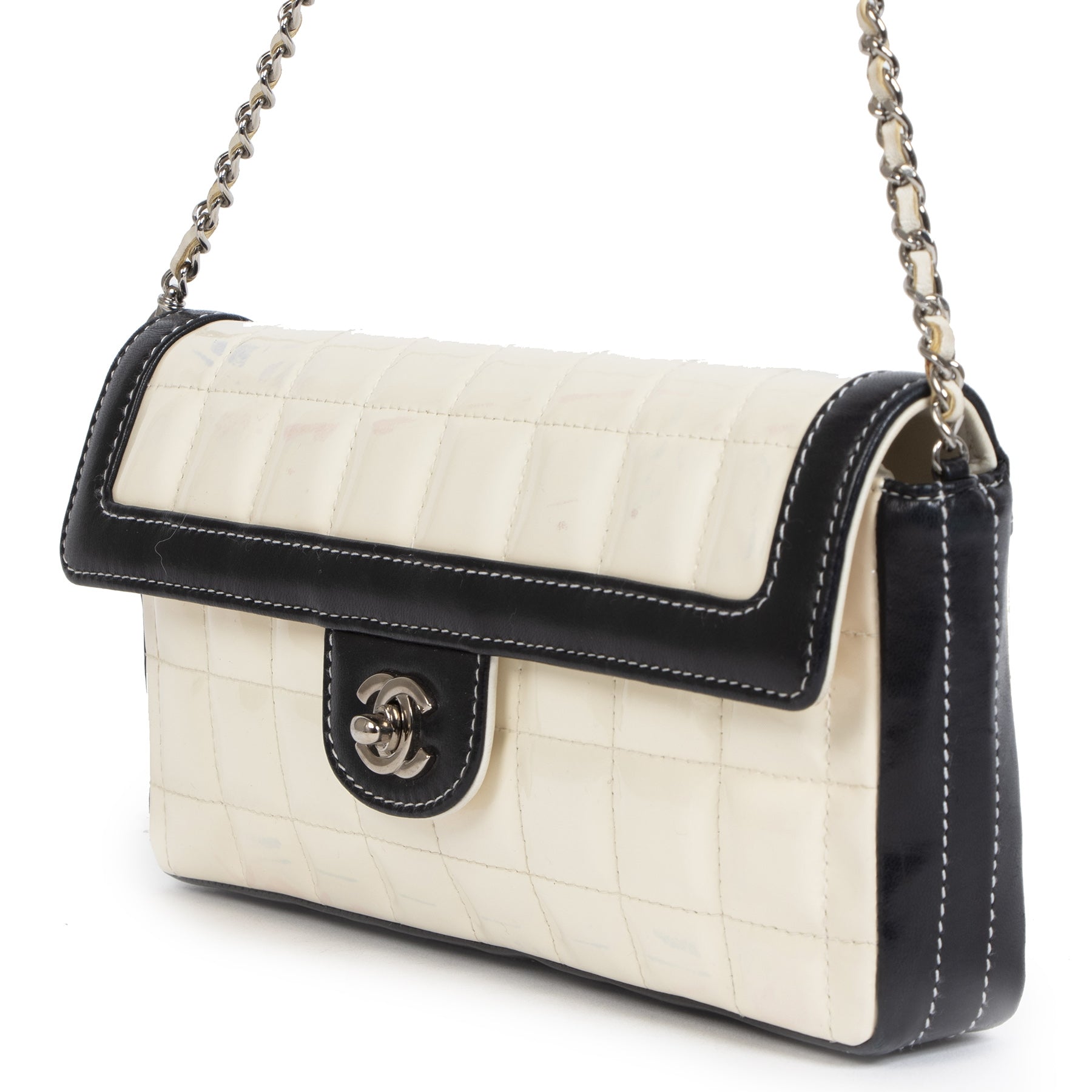 We buy and sell your authentic designer Chanel East West Chocolate Bar White Patent Leather Bag