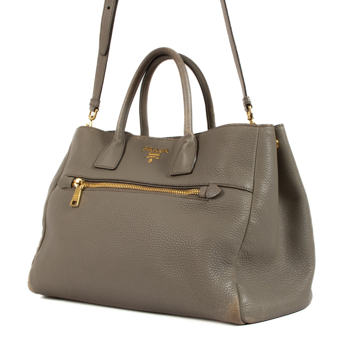 Shop safe online at Labellov in Antwerp, Brussels and Knokke this 100% authentic second hand Prada Taupe Leather Top Handle Bag