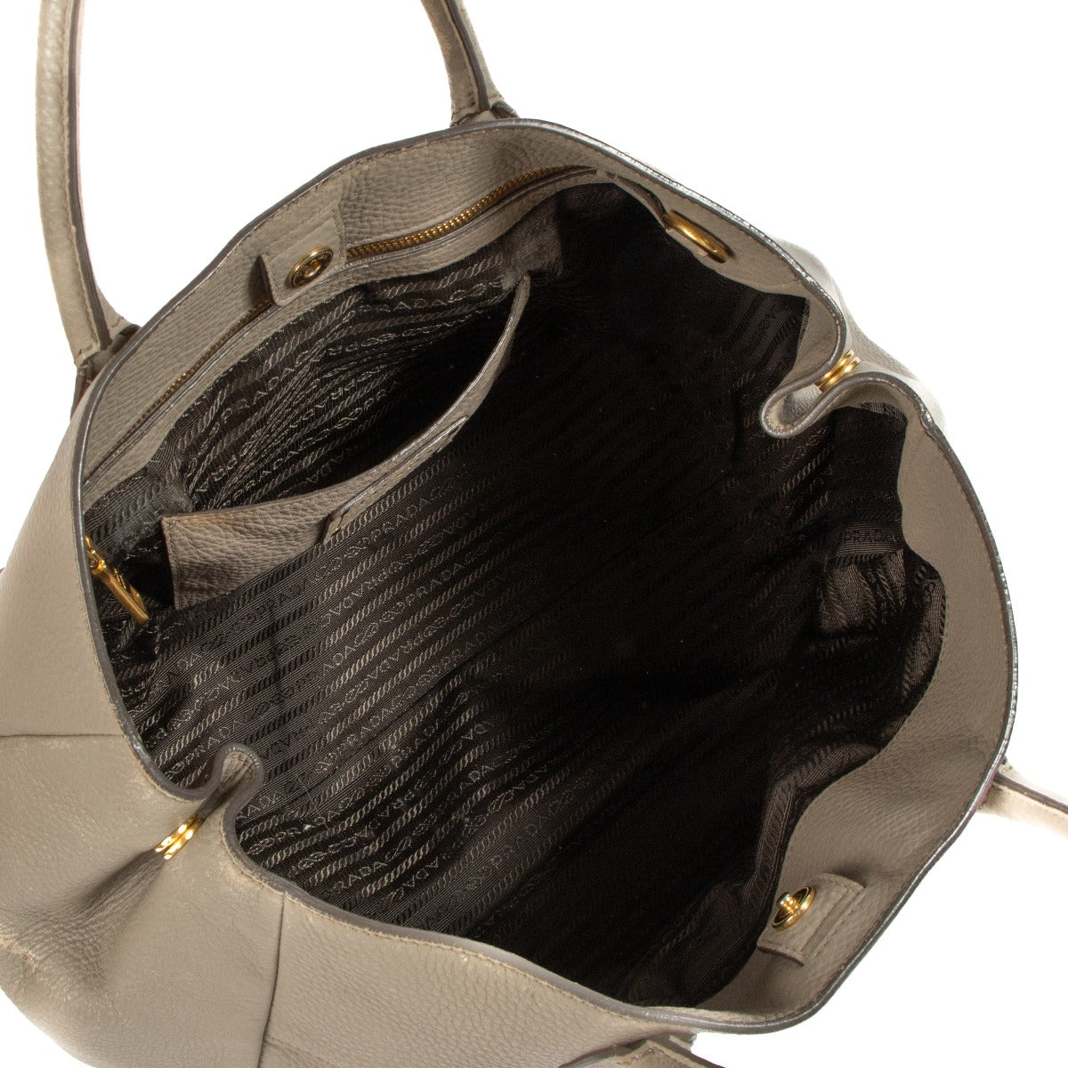 Shop safe online at Labellov in Antwerp, Brussels and Knokke this 100% authentic second hand Prada Taupe Leather Top Handle Bag