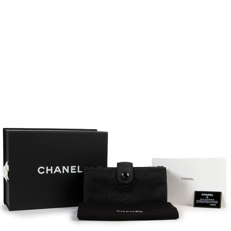 buy and sell one of a kind exclusive collectors pieces of brands such as Chanel and this stunning Chanel Black Python Multiflap Clutch Bag