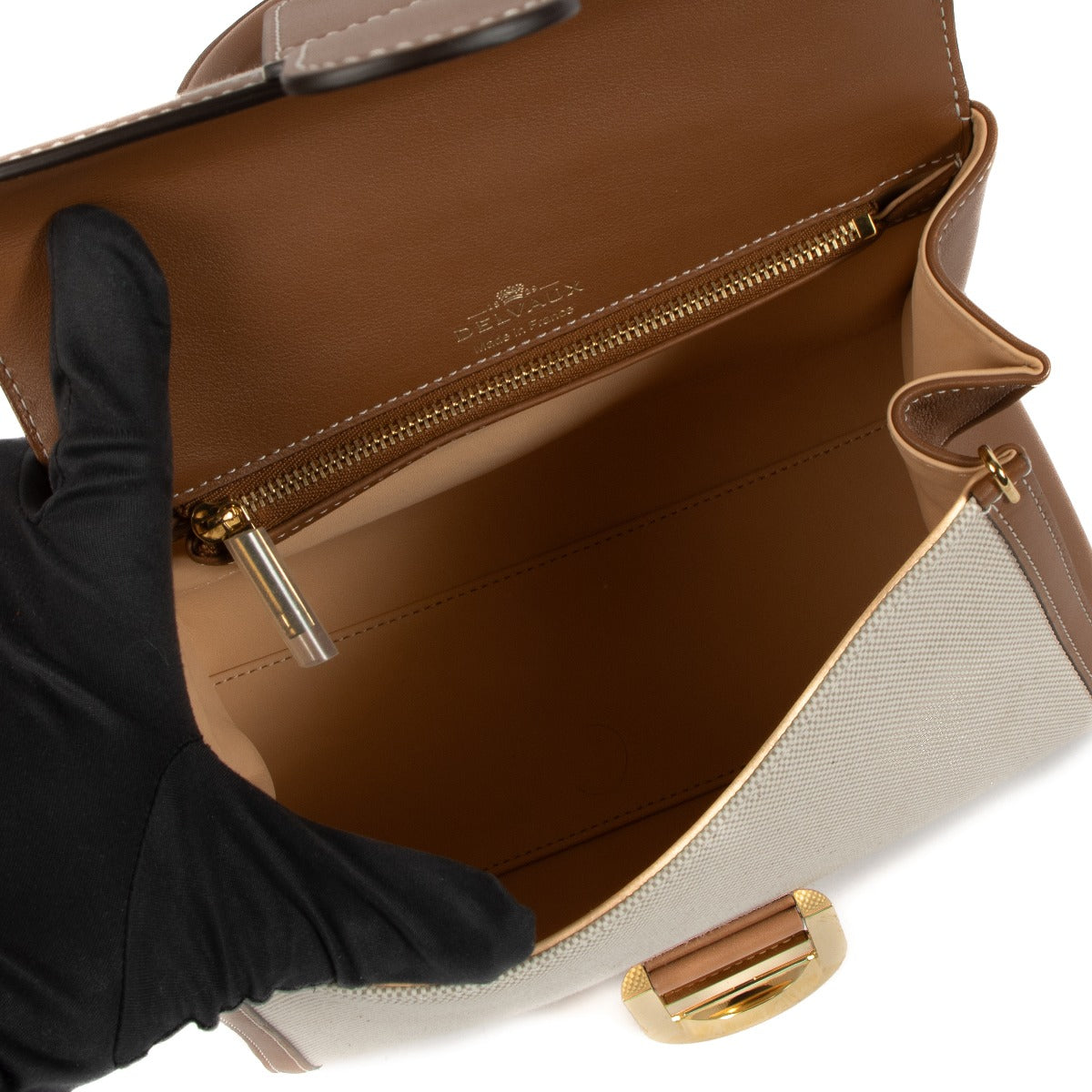 Shop safe online at Labellov in Antwerp, Brussels and Knokke this 100% authentic second hand Delvaux Natural / Tan Calf Trim Canvas Brillant PM Bag