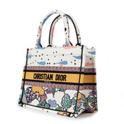Shop safe online at Labellov in Antwerp this 100% authentic second hand Christian Dior Latte-Coloured Ciel De Rêve Embroidery Small Book Tote