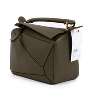 Shop safe online at Labellov in Antwerp and Knokke this 100% authentic second hand Loewe Khaki Calfskin Puzzle Edge Small Hand Bag