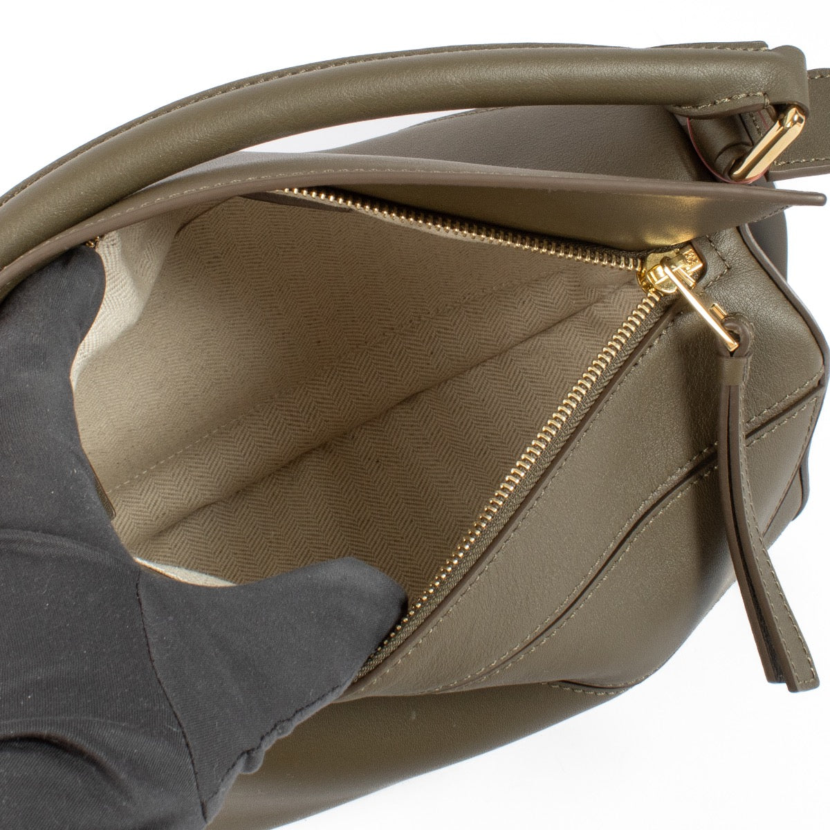 Shop safe online at Labellov in Antwerp and Knokke this 100% authentic second hand Loewe Khaki Calfskin Puzzle Edge Small Hand Bag