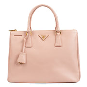 Shop safe online at Labellov in Antwerp, Brussels and Knokke this 100% authentic second hand Prada Pink Saffiano Galleria Top Handle Bag
