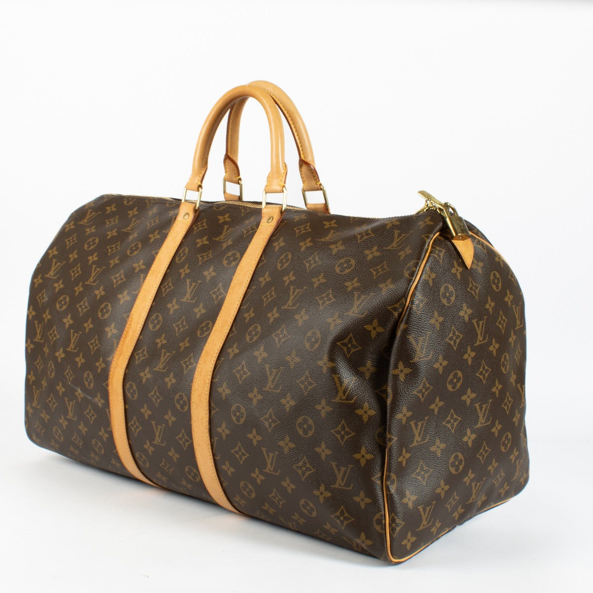 Authentic Louis Vuitton Keepall 50 in Monogram canvas with vachetta leather trim at Labellov.com