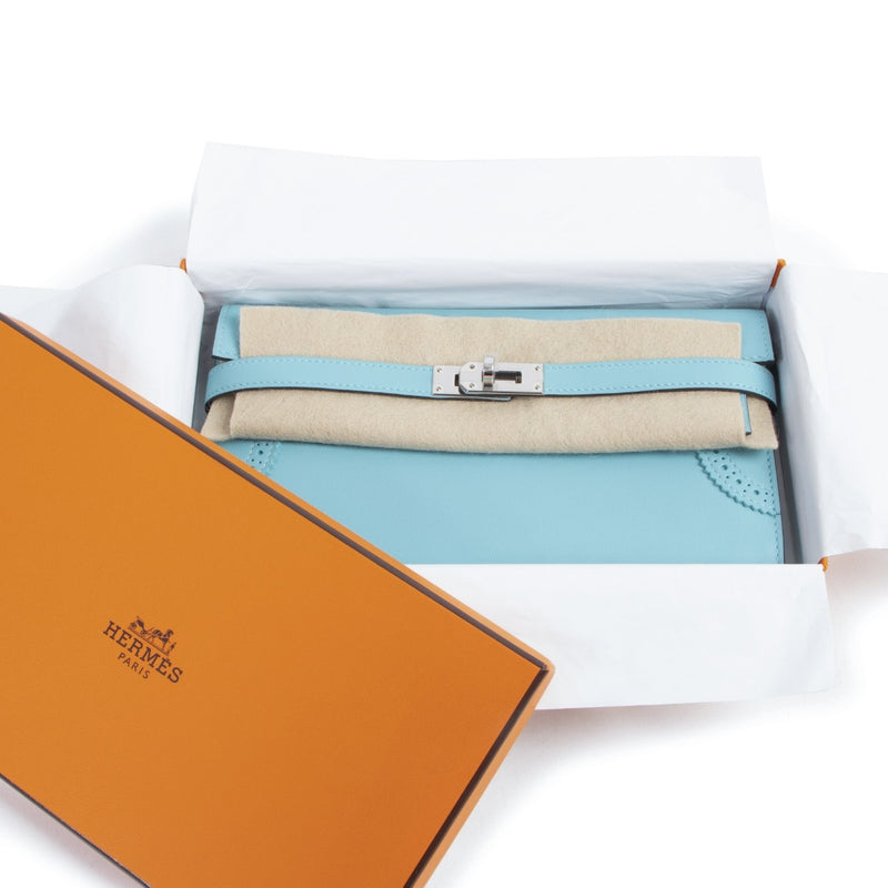 NEW Hermes Kelly Classic Ghillies Wallet Veau Swift Blue Atoll PHW on www.labellov.com. Shop safe and secure online. Preowned handbags. Worldwide shipping.