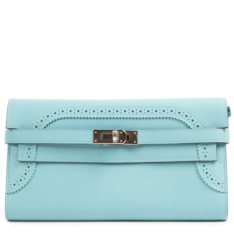 NEW Hermes Kelly Classic Ghillies Wallet Veau Swift Blue Atoll PHW on www.labellov.com. Shop safe and secure online. Preowned handbags. Worldwide shipping.