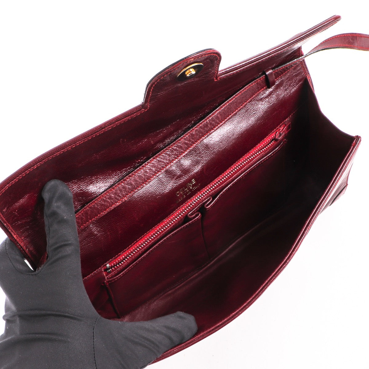 Shop safe online at Labellov in Antwerp this 100% authentic second hand Celine Burgundy Triomphe Vintage Shoulder Bag