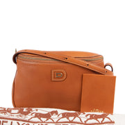 Veilige tweedehands authentieke oranje Delvaux crossbody handtas kopen.