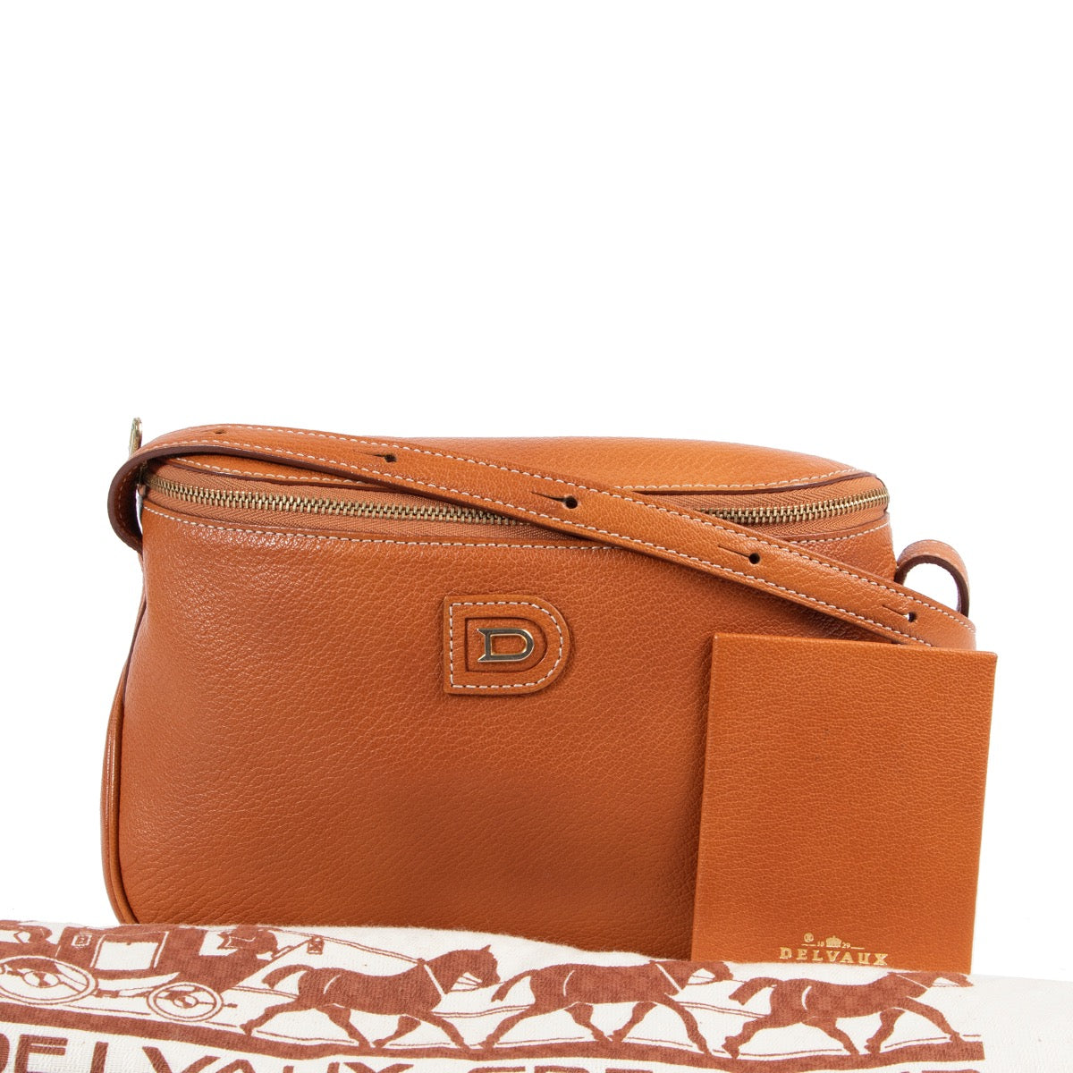 Veilige tweedehands authentieke oranje Delvaux crossbody handtas kopen.