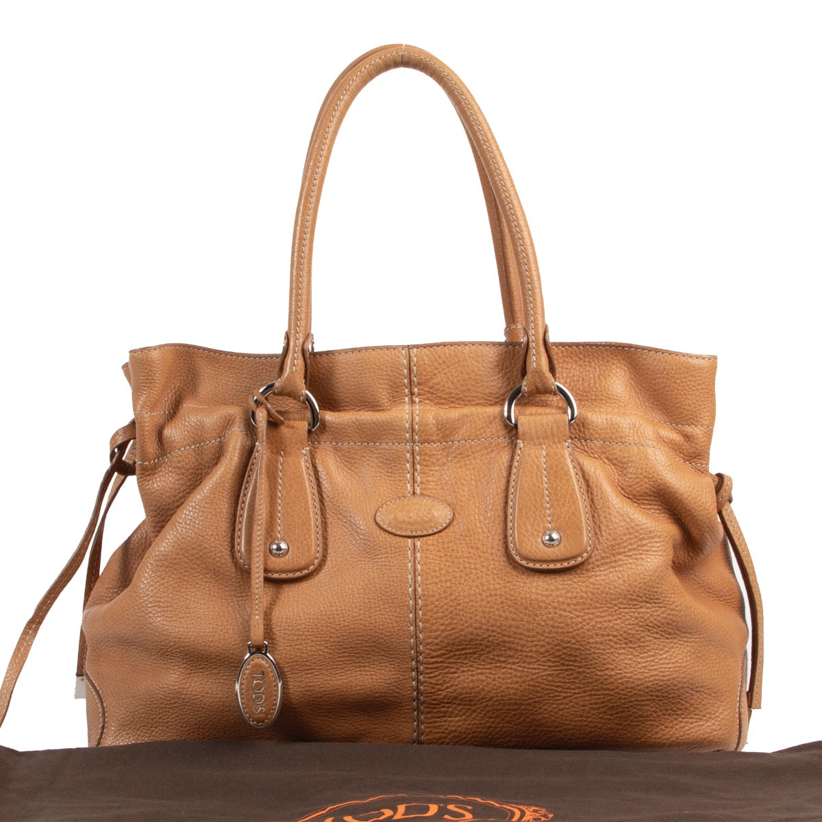 Shop second hand Tod's top handle bag in camel leather.