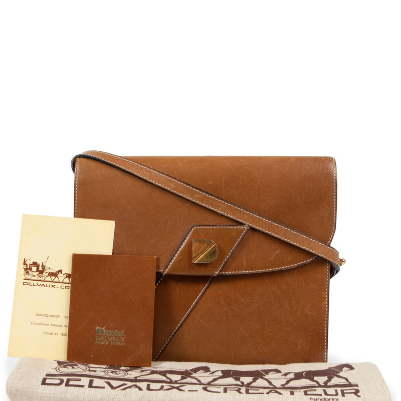 Veilig online kopen van authentieke bruine Delvaux schouder handtas bij Labellov.com.