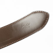 Authentic Cartier black leather belt with gold C buckle, measuring 117 cm, available at Labellov.com.