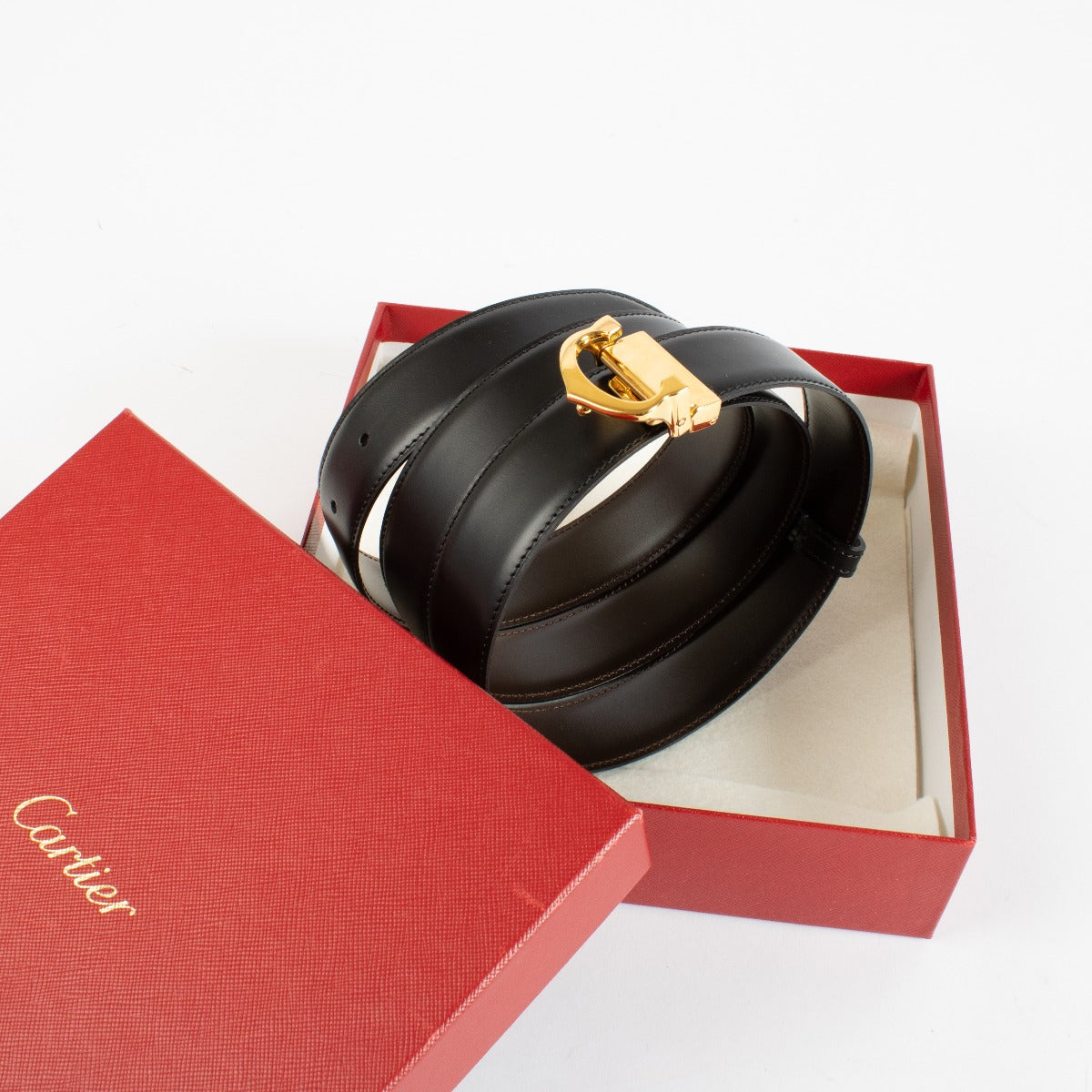 Authentic Cartier black leather belt with gold C buckle, measuring 117 cm, available at Labellov.com.