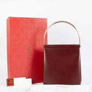 Authentic Cartier Burgundy Trinity Bag with gold handle at Labellov.com