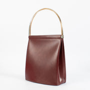 Authentic Cartier Burgundy Trinity Bag with gold handle at Labellov.com