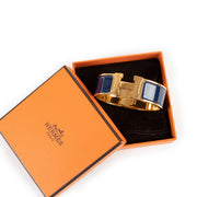 Hermès Clic H Blue Bracelet Buy this 100% authentic Hermès Masterpiece safely here.