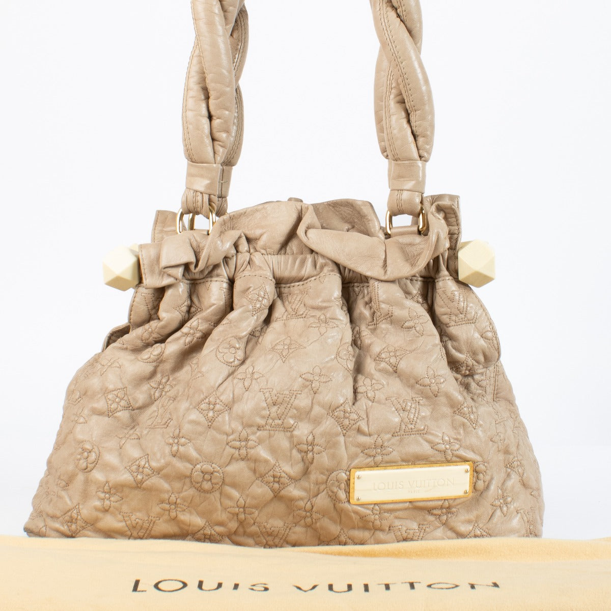 Shop the Louis Vuitton Olympe Stratus PM Bag in beige at Labellov. Crafted from soft monogram-embossed leather, this elegant pre-loved handbag features twisted handles, gold-tone details, and timeless Louis Vuitton craftsmanship. A chic and collectible pi