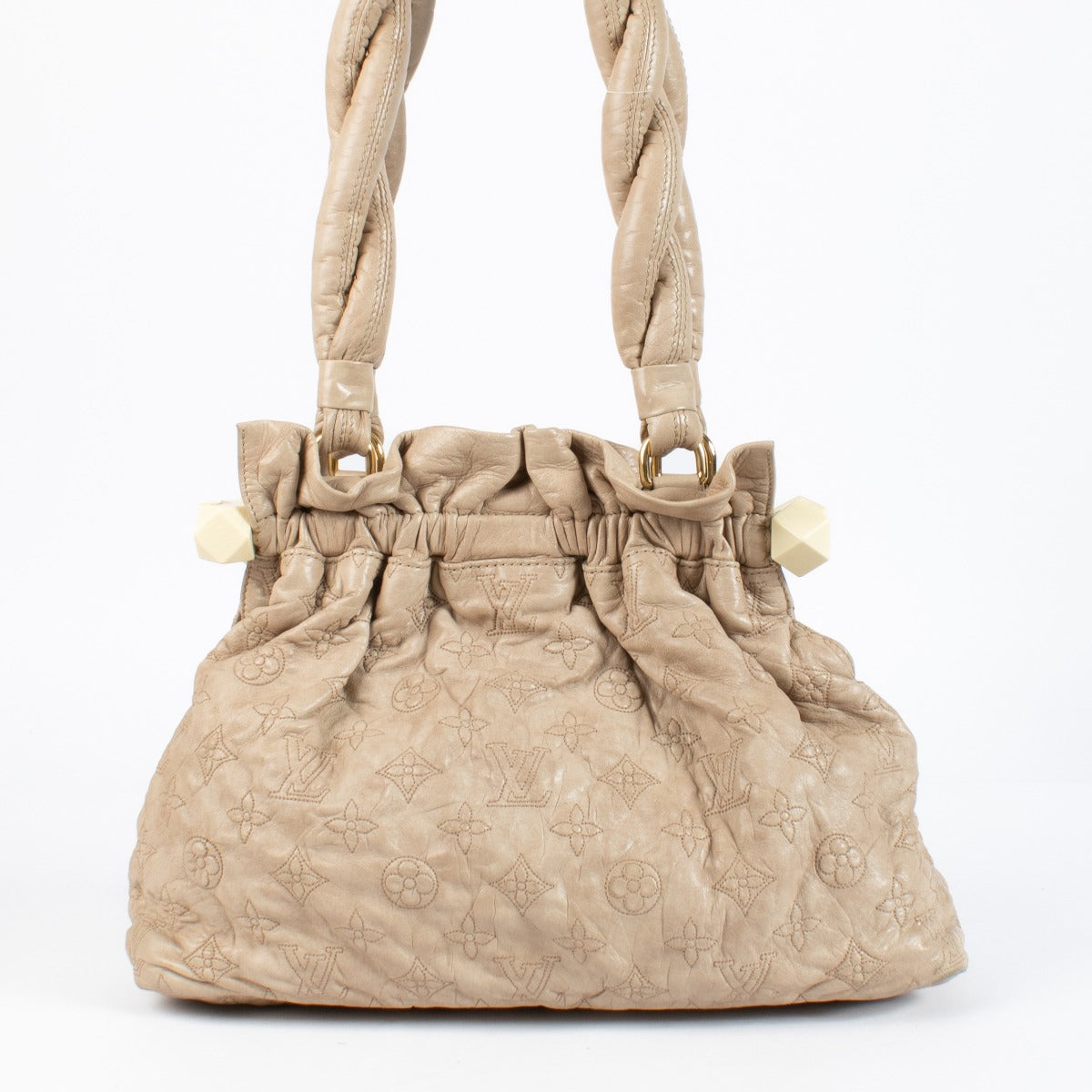 Shop the Louis Vuitton Olympe Stratus PM Bag in beige at Labellov. Crafted from soft monogram-embossed leather, this elegant pre-loved handbag features twisted handles, gold-tone details, and timeless Louis Vuitton craftsmanship. A chic and collectible pi