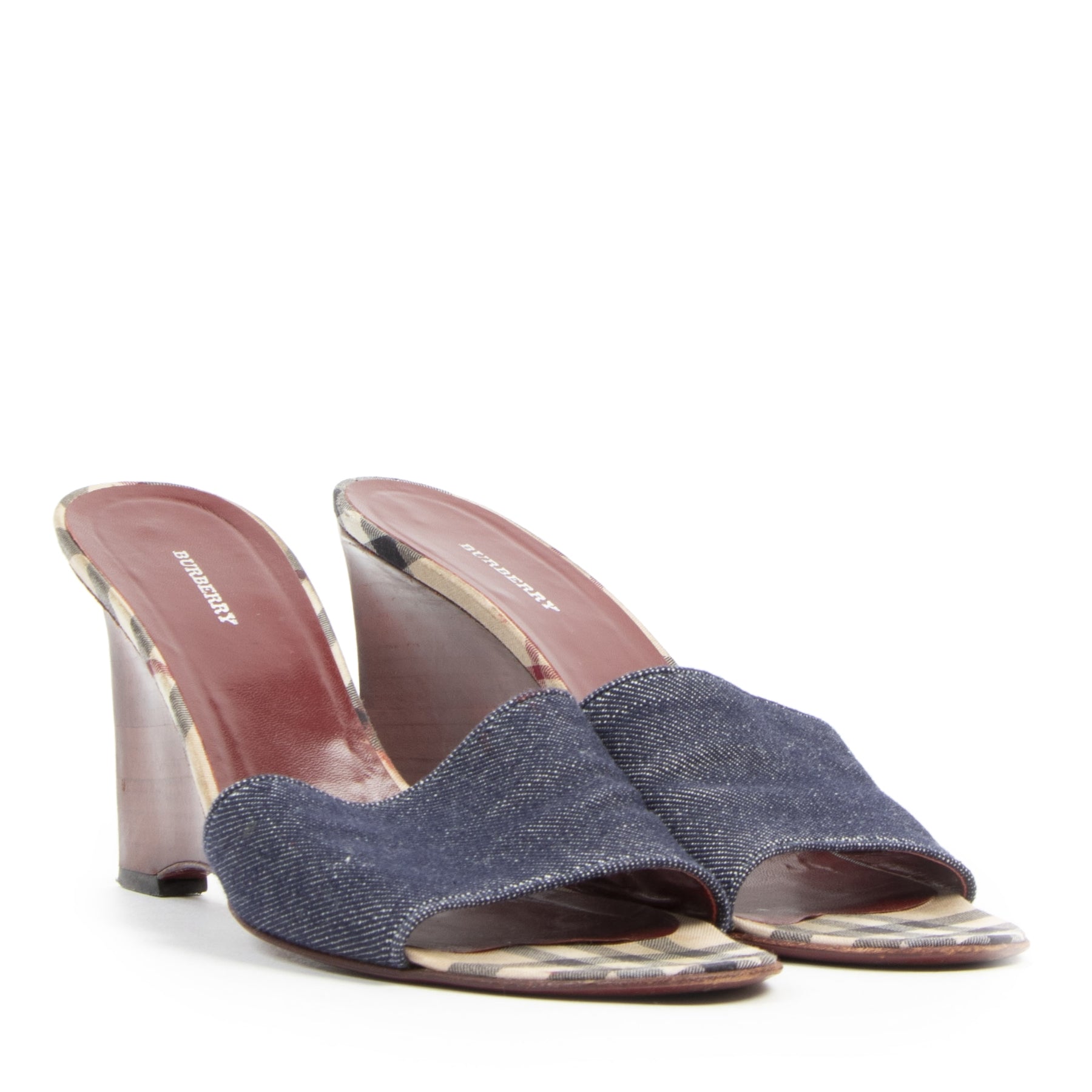 Are you looking for an authentic designer Burberry Wooden Slide On Heels - Size 40