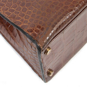 Hermès Kelly 32 Miel Crocodile GHW corners perspective in good condition