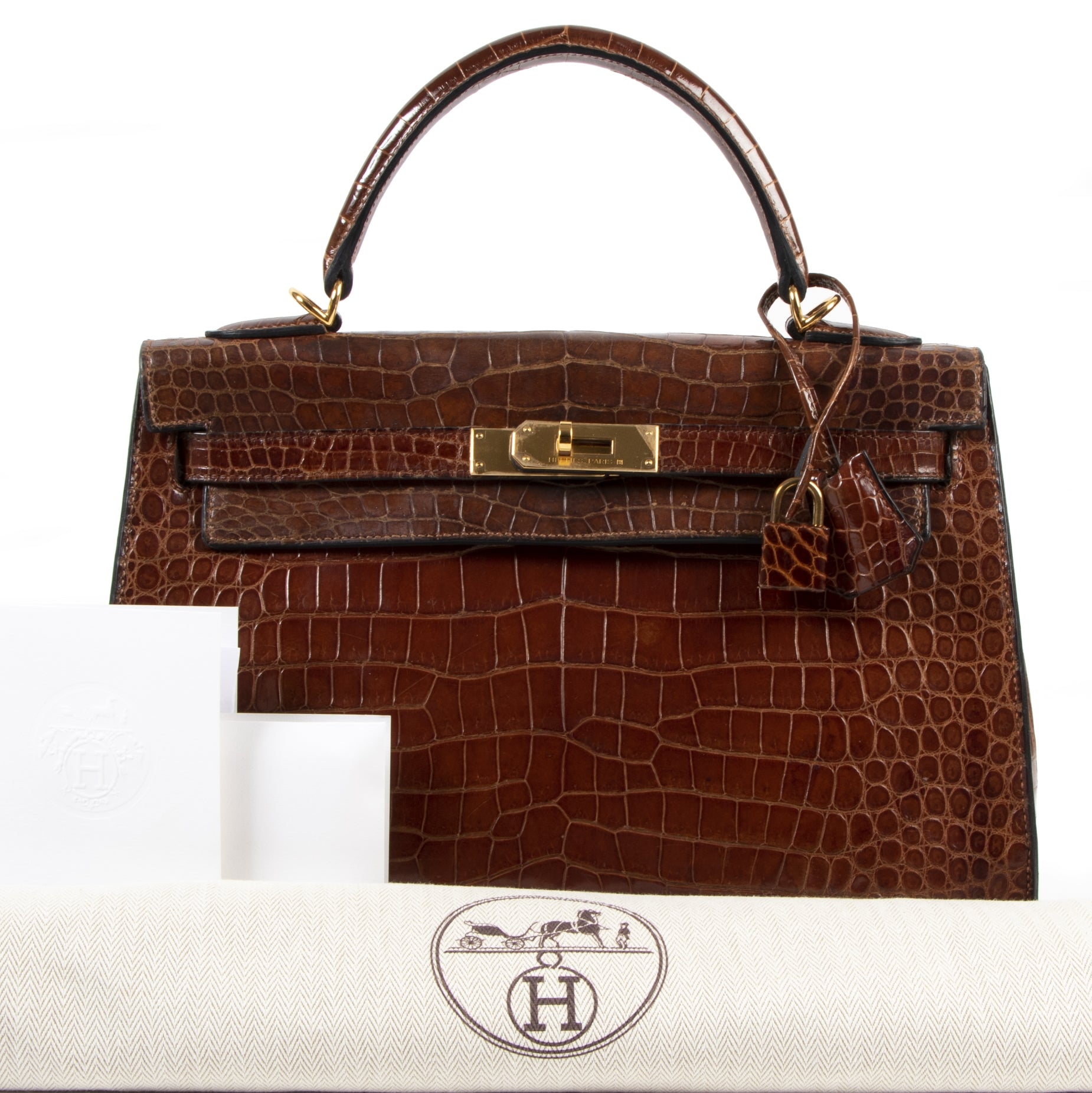 Buy and sell preloved designer vintage Hermès Kelly 32 Miel Crocodile GHW